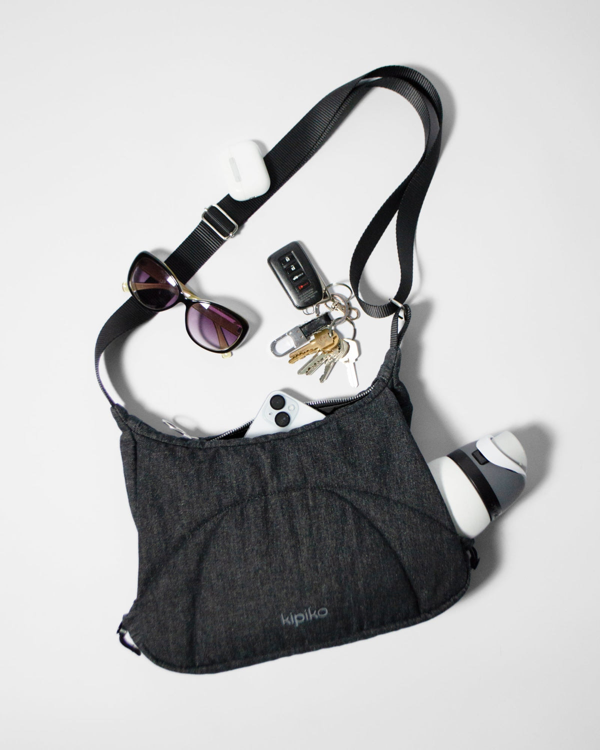 Bottle Bag in Black Denim / Black, contents spilled out