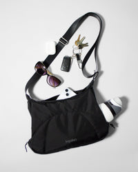 Bottle Bag in Black Crinkle Nylon / Black, contents spilled out